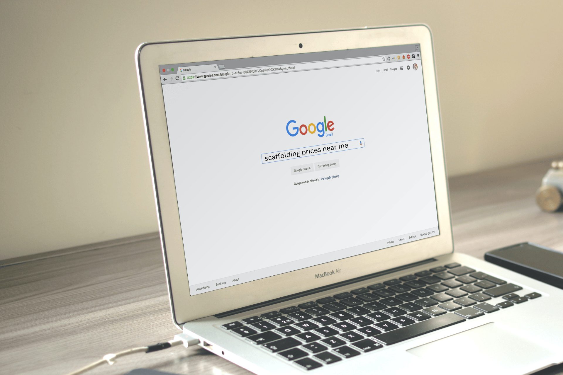 A MacBook Air with a Google page opened where a search of scaffolding prices near me has been entered